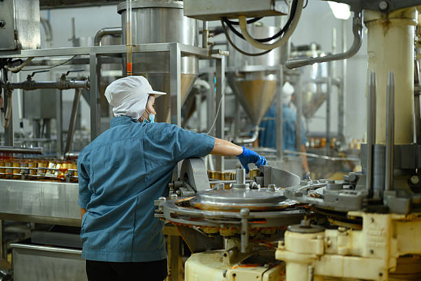 Male Worker at Traditional Tofu Factory, Pouring Water to Big Soya Bean Strainer