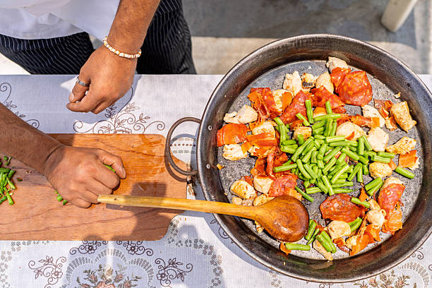 istock Chef preparing paella outdoors for family lunch 2209462366