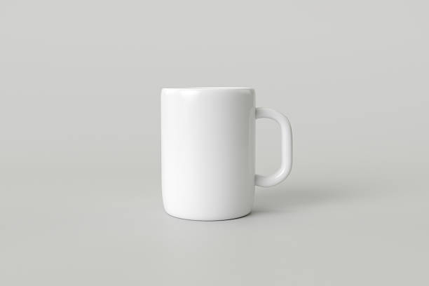 istock Close-up white coffee mug on grey background. 2209462507