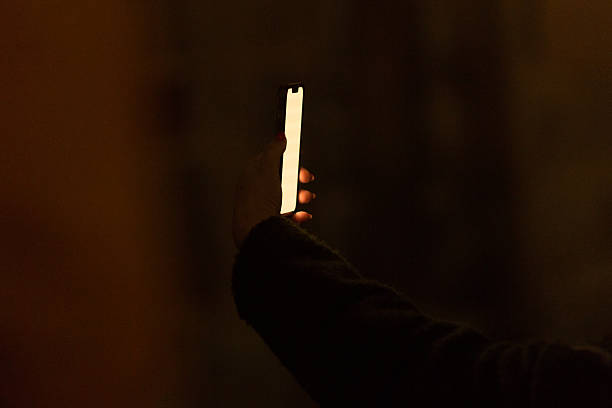 istock Closeup smartphone being used outdoors at night. Innovation in communication 2209464136