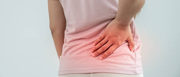 istock woman holding lower back while and suffer from unbearable pain health and problems, chronic back pain, backache in office syndrome, scoliosis, herniated disc, muscle inflammation 2209468091