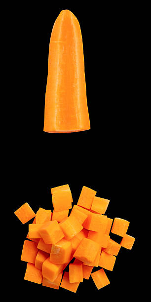 istock Top view set of orange carrot slices in cube shape and stick in stack isolated on black background with clipping path 2209473415