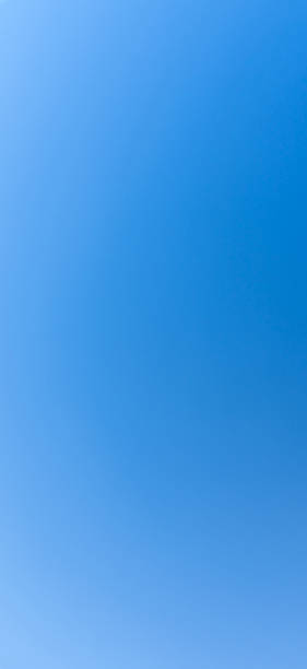 istock Full frame and low angle view of beautiful blue sky without clouds in the morning or evening used as natural background texture in decorative art work 2209473738