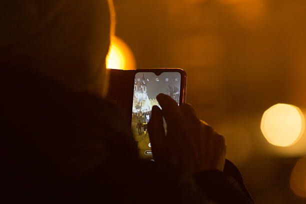 istock Close-Up of Smartphone in Hand at Night or evening. Modern technology 2209473811
