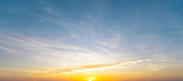 istock Full frame of beautiful morning or evening blue and orange sky with cloudy while sunsets or sunrises taken at the sea used as natural blackground texture 2209474355