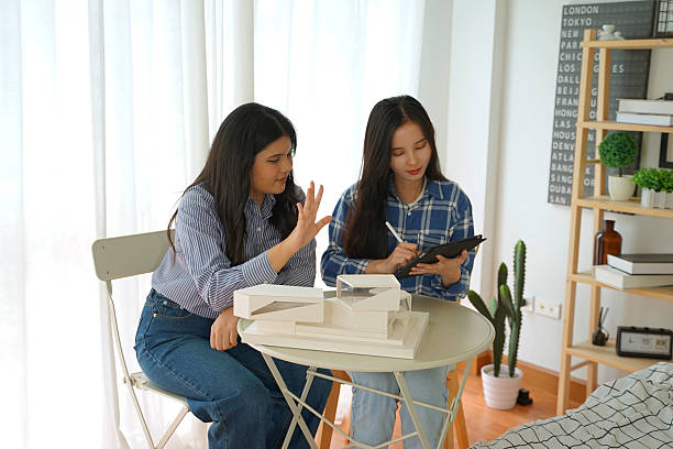 istock Woman and friend are learning architecture at home. 2209478191