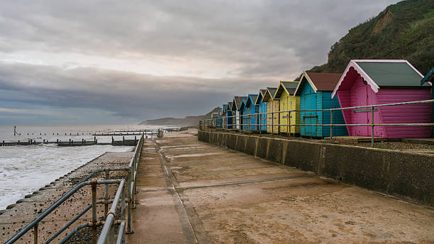 istock Dark clouds over the beach huts on Overstrand Beach, Norfolk, England, UK 2209484562