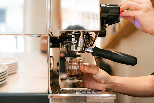 istock Barista Pulling Fresh Espresso Shot in Coffee Shop 2209489369