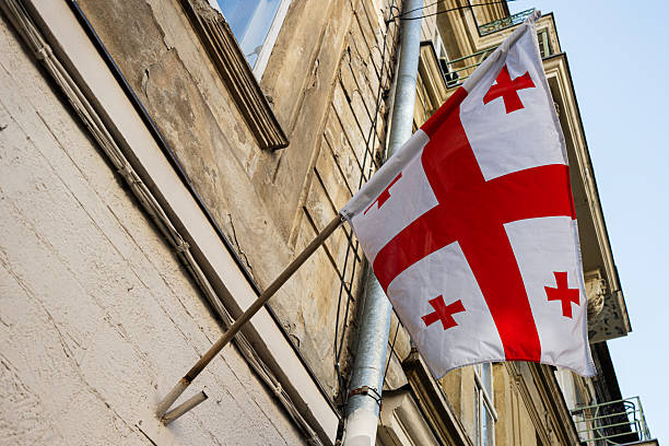 istock Flag of Georgia displayed on building facade 2209490218
