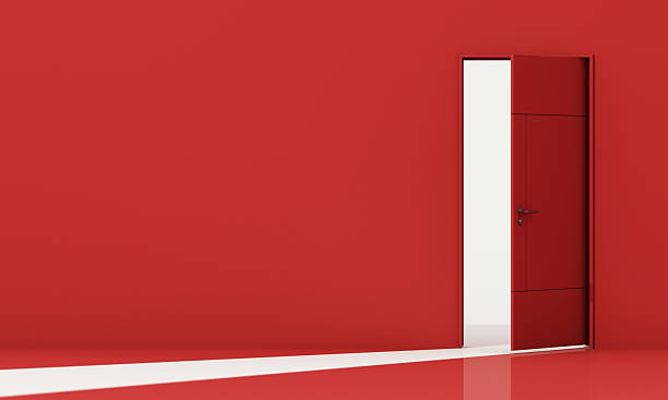 istock Open red door stands in a bold red space, inviting change, mystery, and transformation through minimal contrast and symbolic light. 3d rendering. 2209490965