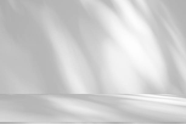 istock Wall interior background, studio and backdrops show products.with shadow from window color white . background for text insertion and presentation product 2209492940