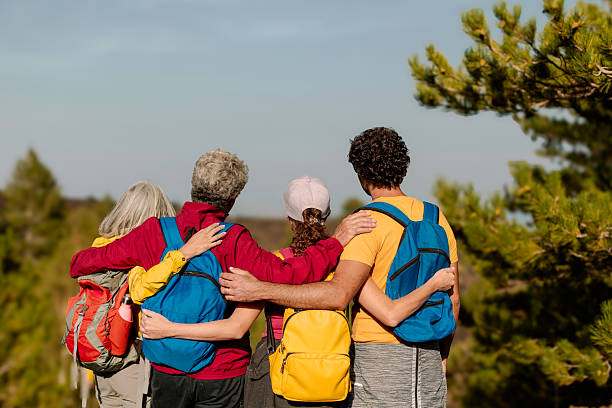 istock Hikers embracing and admiring scenic mountain vista 2209494018