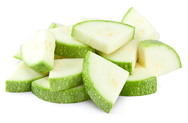 istock sliced fresh green zucchini or marrow isolated on white background. clipping path 2209495343