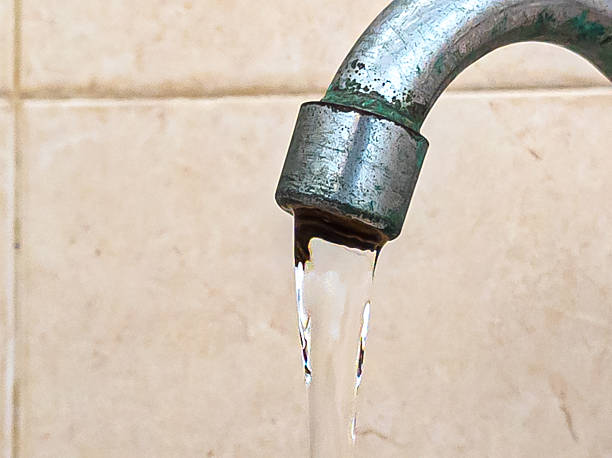 istock A leaky faucet drips water. 2209498242