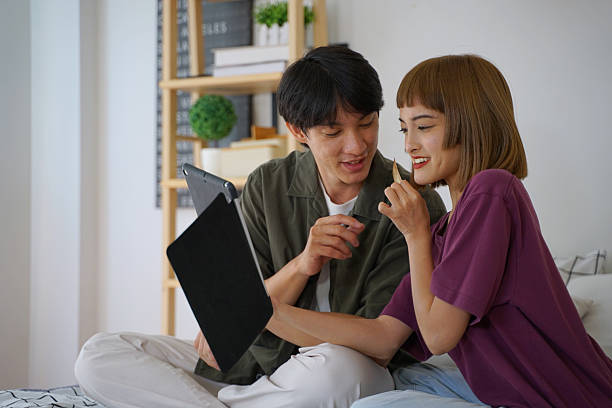 istock Couple checking document for travel trip at home. 2209500070