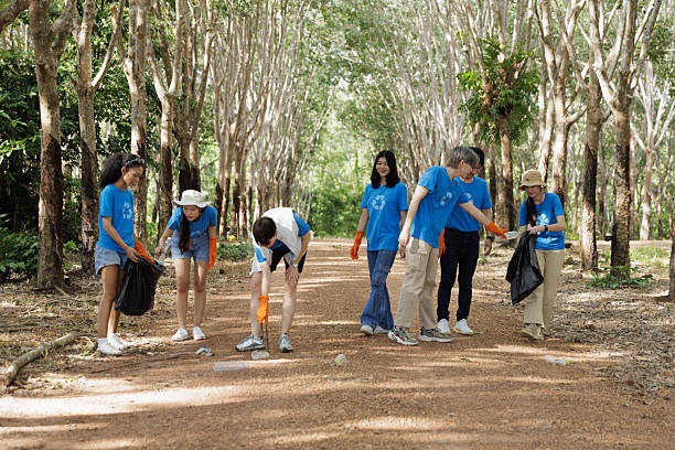 istock Group of Volunteers Collecting Garbage in Forest, Environmental Conservation 2209506285