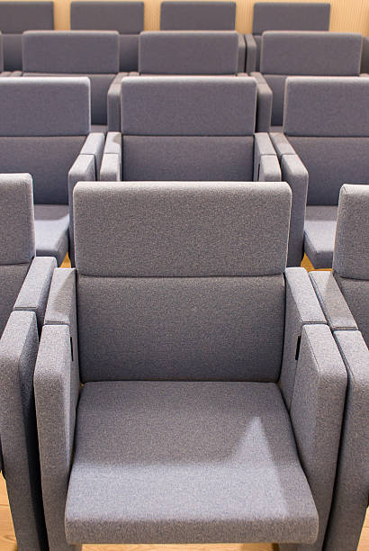 istock chairs for halls, the ability to quickly organize an area for spectators and remove it, adjust the number of seats, their location in the hall 2209506351