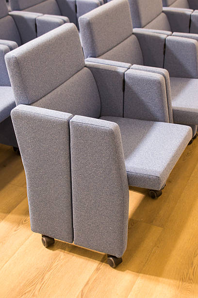 istock chairs for halls, the ability to quickly organize an area for spectators and remove it, adjust the number of seats, their location in the hall 2209506422