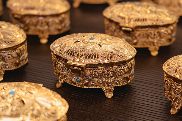 istock Ornate Gold Jewelry Box Display with Intricate Design 2209509365