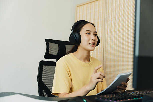 istock Young woman engages in online discussion while working from home in a modern workspace during the day 2209510775