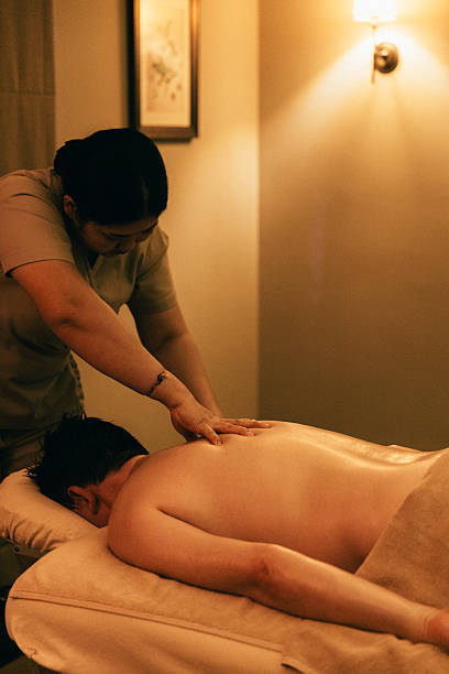 istock Man relaxing during back massage at the spa 2209513081