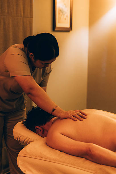 istock Man relaxing during back massage at the spa 2209516281