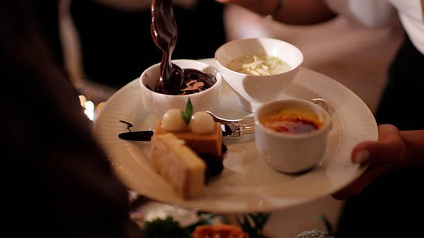 preparation of alfajores of dulce de leche bathed in chocolate