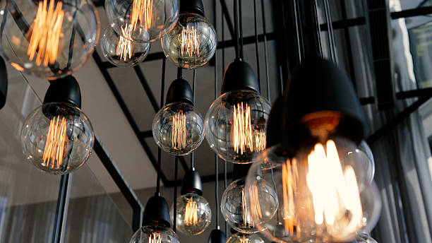 istock Use of lighting in interior architectural design, Modern electric light bulbs, Design light bulbs, Low angle shot 2209523112