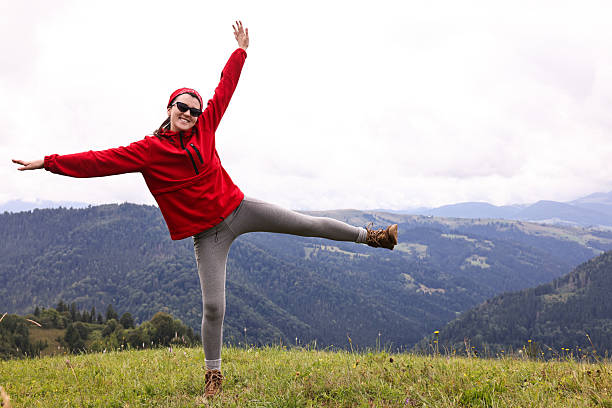 Happy young hiker in mountains. Active tourism