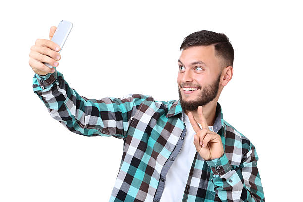 istock Young man making selfie on smartphone on blue background 2209530152