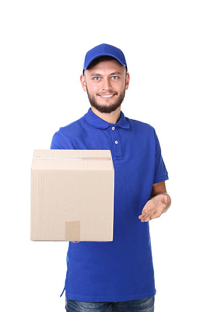 istock Delivery man with cardboard box isolated on white background 2209530372