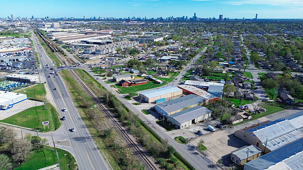 istock Hempstead railroad with downtown Houston skyline background, Industrial Park in Northwest Houston submarket near US-290, Highway 6, Interstate 10, complex logistics, warehousing, distribution hub 2209530821