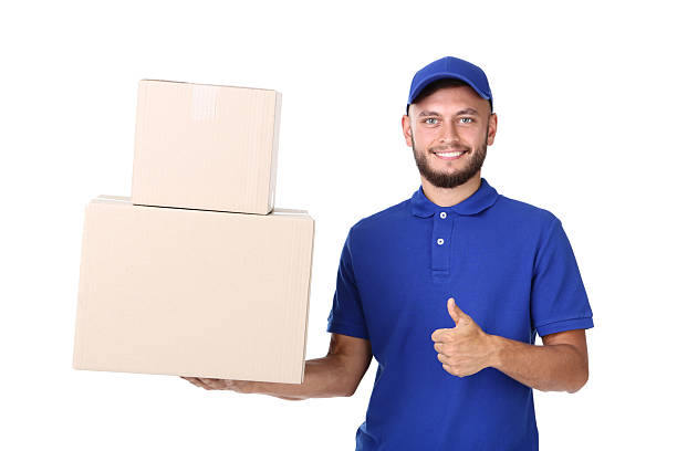 istock Delivery man with cardboard boxes isolated on white background 2209531075