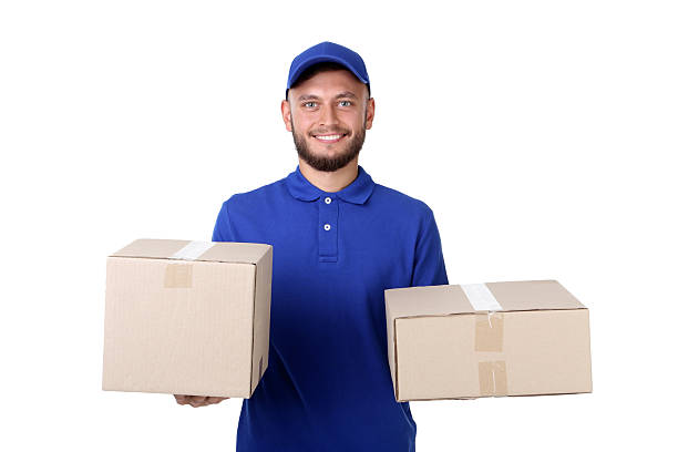 istock Delivery man with cardboard boxes isolated on white background 2209531185