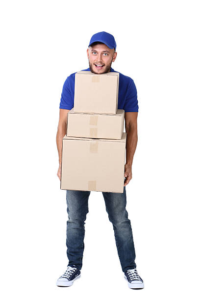 istock Delivery man with cardboard boxes isolated on white background 2209531415