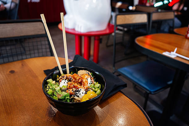 istock Delicious poke bowl with shrimp served at a modern dining restaurant 2209532828