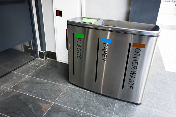 istock Modern recycling bins for plastic, paper, and waste in public location 2209532831