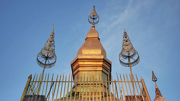 A golden stupa with a square lotus-shaped design, Luang Prabang