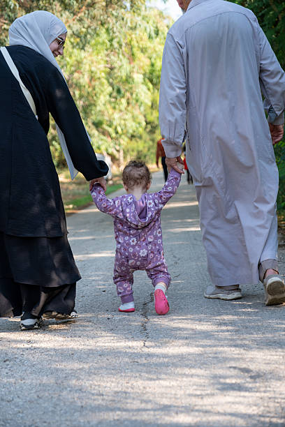 istock Family Taking a Peaceful Stroll Outdoors in a Park Setting 2209540254