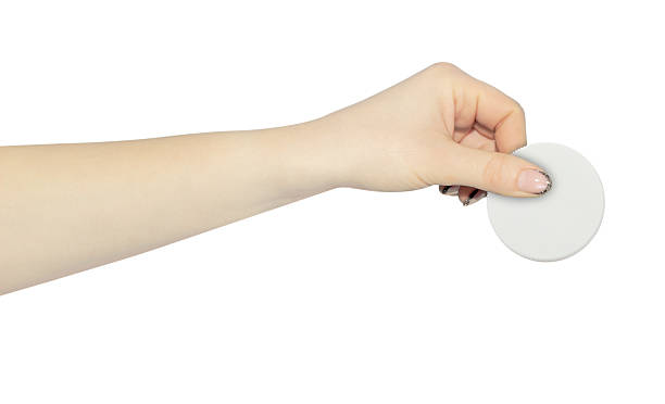 istock wide cap from a plastic bottle in hand, outstretched hand with cap from a plastic bottle isolated from background 2209541867