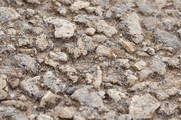 istock Rough Natural Stone and Gravel Texture Surface Closeup 2209542253