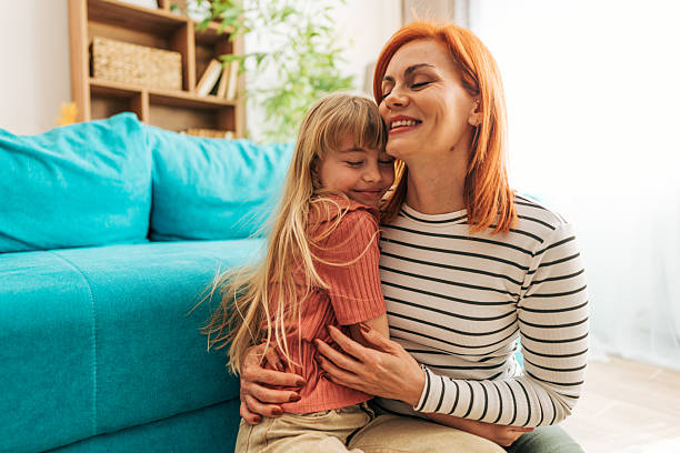 istock Mother and daughter sharing a tender hug at home 2209544259