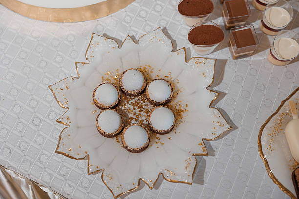 istock A white plate with a gold rim and a flower design on it 2209546656