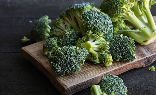 istock Fresh organic Broccoli on a wooden board 2209557672