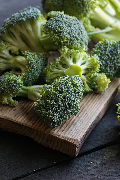 istock Fresh organic Broccoli on a wooden board 2209557697