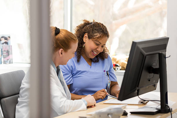 istock Two Female Healthcare Professionals Working Together at a Computer 2209560415