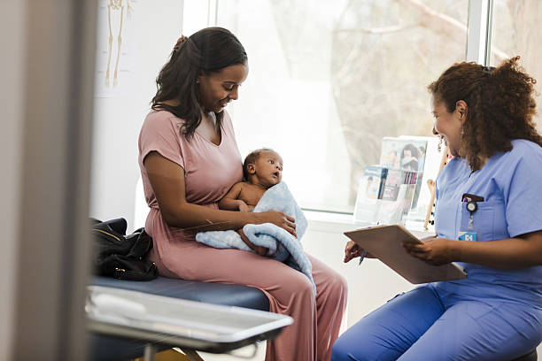 istock Happy Mother and Baby at Doctor's Office Visit 2209560426