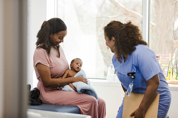 istock Happy Mother and Baby at Doctor's Appointment 2209560430