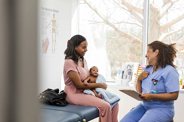 istock Happy Mother and Baby at Doctor's Office Visit 2209560480