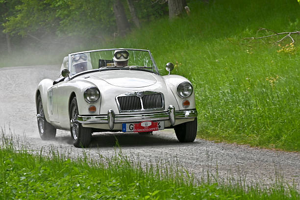 Baden-Baden, Germany - 10 July 2022: grey gray MG MGA sport coupe 1955 coupe cabrio roadster is parked in Kurpark in Baden-Baden at the exhibition of old cars \